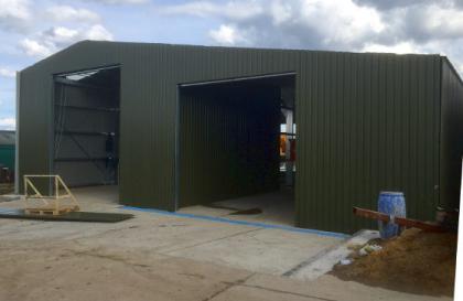 Storage shed for a farm with traction engine