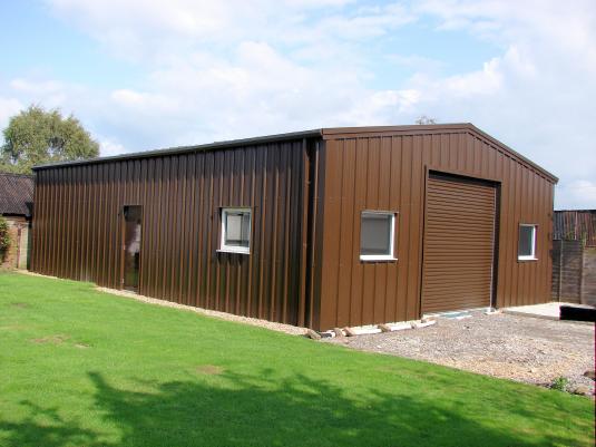 Exterior view of food processing unit with full steel roller door, two personnel doors and windows