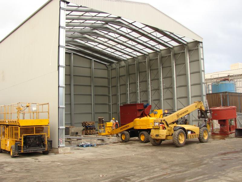 Initial construction of the waste treatment building - note the height and size