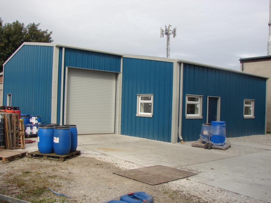 Exterior view showing roller door, PA door and windows for good interior lighting