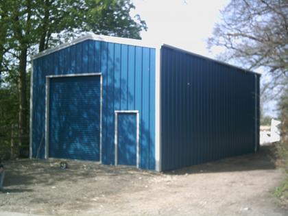 Smart new steel building with front and back steel roller doors and PA door