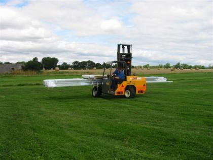 Use a forklift or cherrypicker to handle the frame