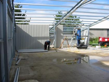 Frame with cladding being attached