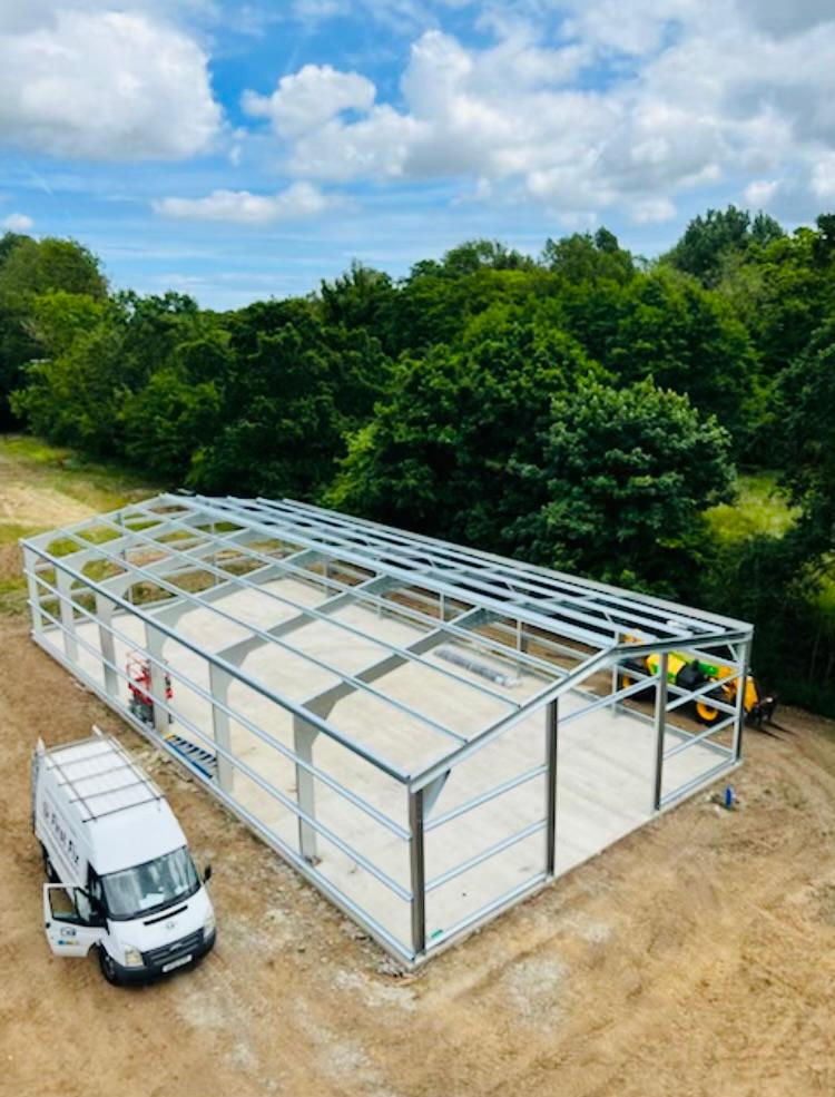 The Blueriver Steel Buildings team coming to add the cladding